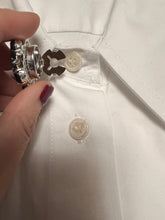 Load image into Gallery viewer, an open button cover about to be put on to top button