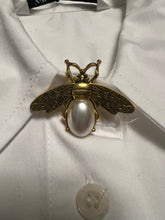 Load image into Gallery viewer, Gold and pearl bee shaped button cover on top button of shirt
