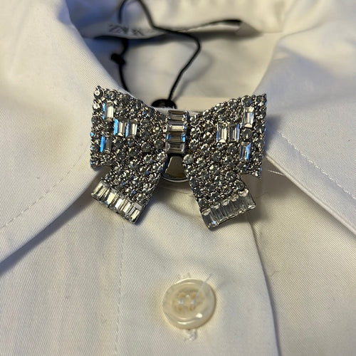 Sparkling diamonte silver button cover worn on top button